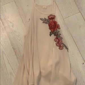 Cream tank top with rose patch